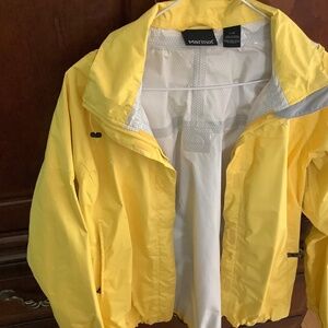 Marmot bright yellow waterproof jacket, size L, with hood.